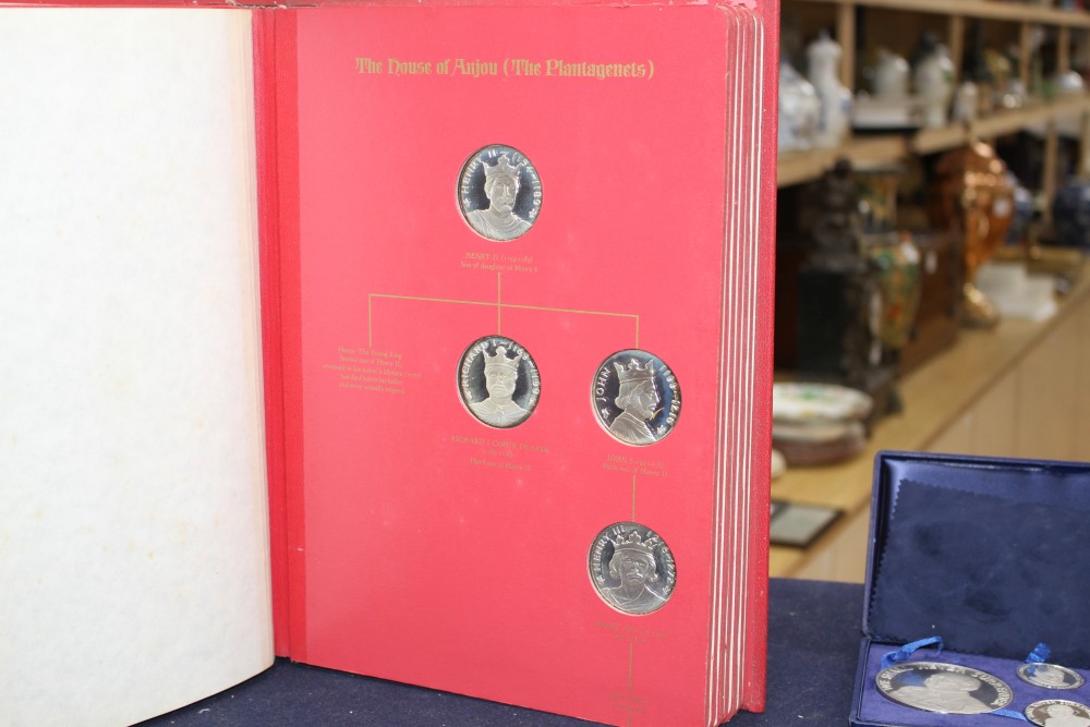 A set of the Kings and Queens of England sterling silver proof medallions, housed in original album and three other cased sets